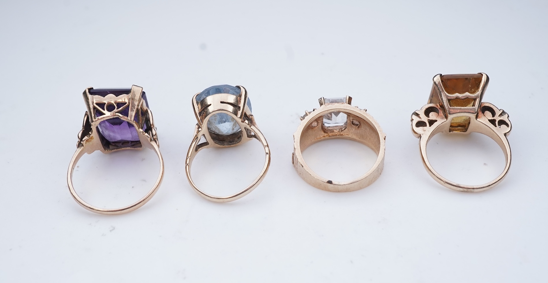 Four gem-set rings